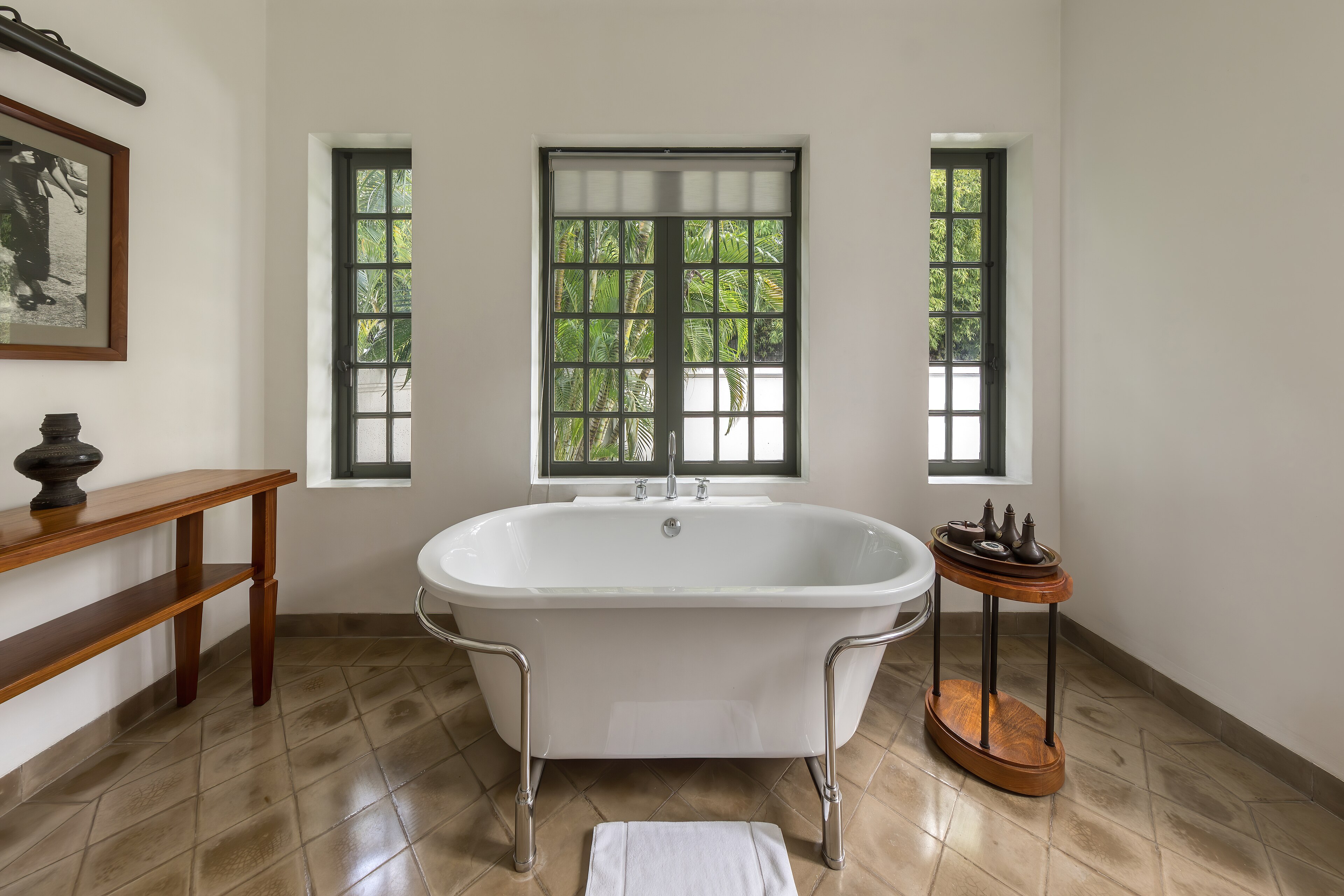 A stone bathtub in a spa-style bathroom